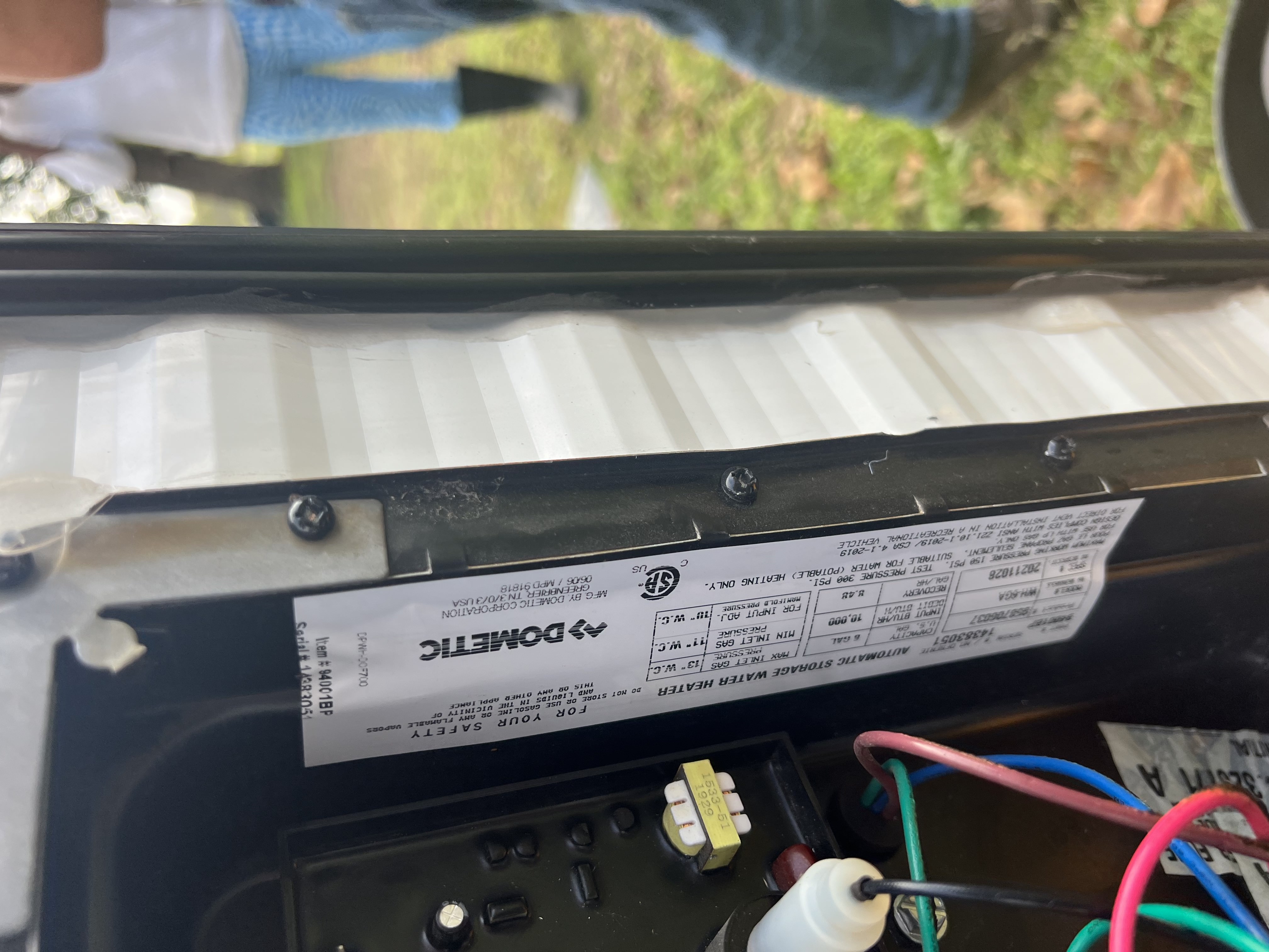 Dometic RV water heater data tag — water heater ignition service and anode rod inspection for Taylor-area travel trailers