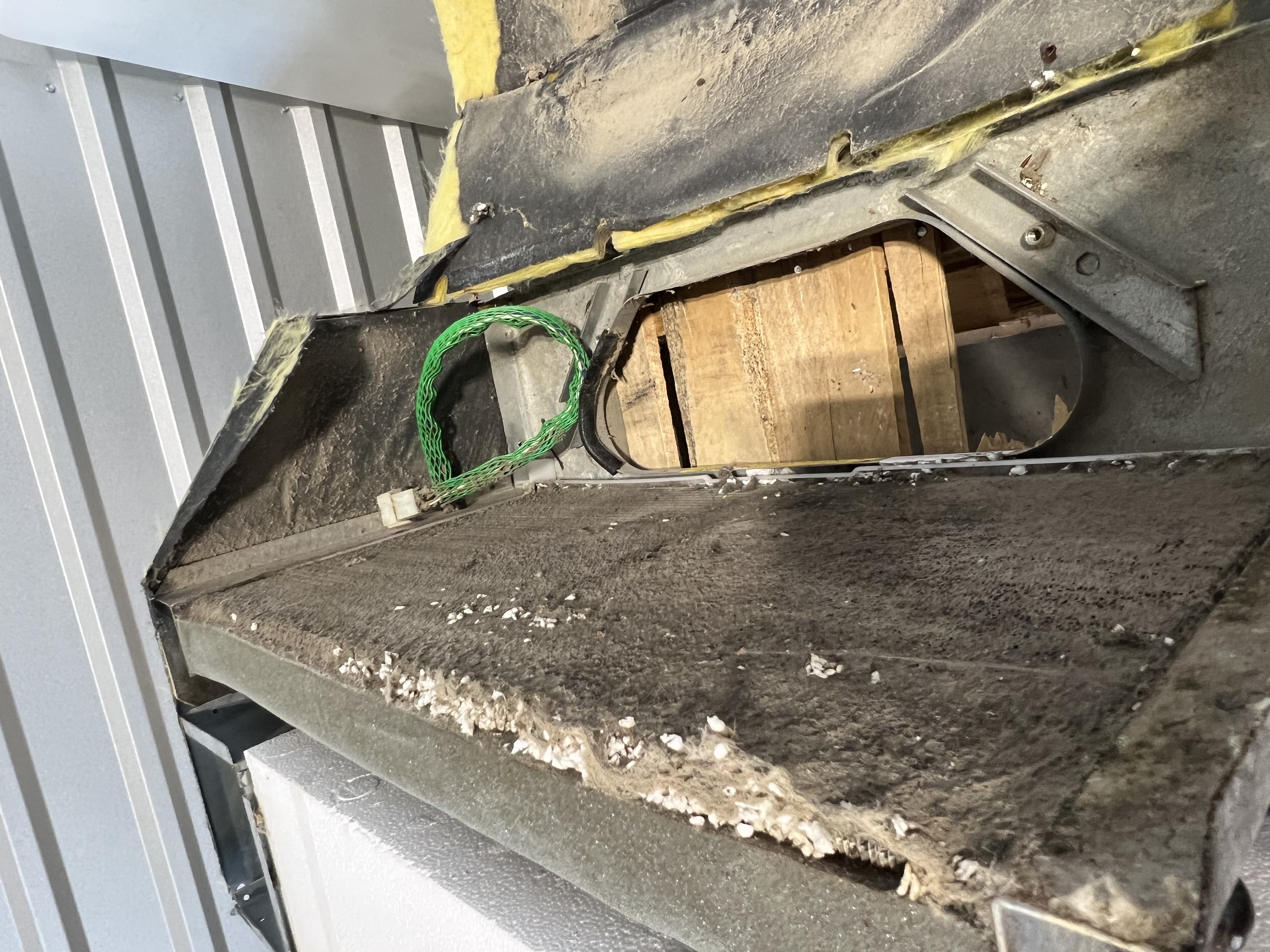 Rooftop RV air conditioner dirty condenser closeup — pre-trip AC diagnosis for a Buda-area family before a Canyon Lake departure