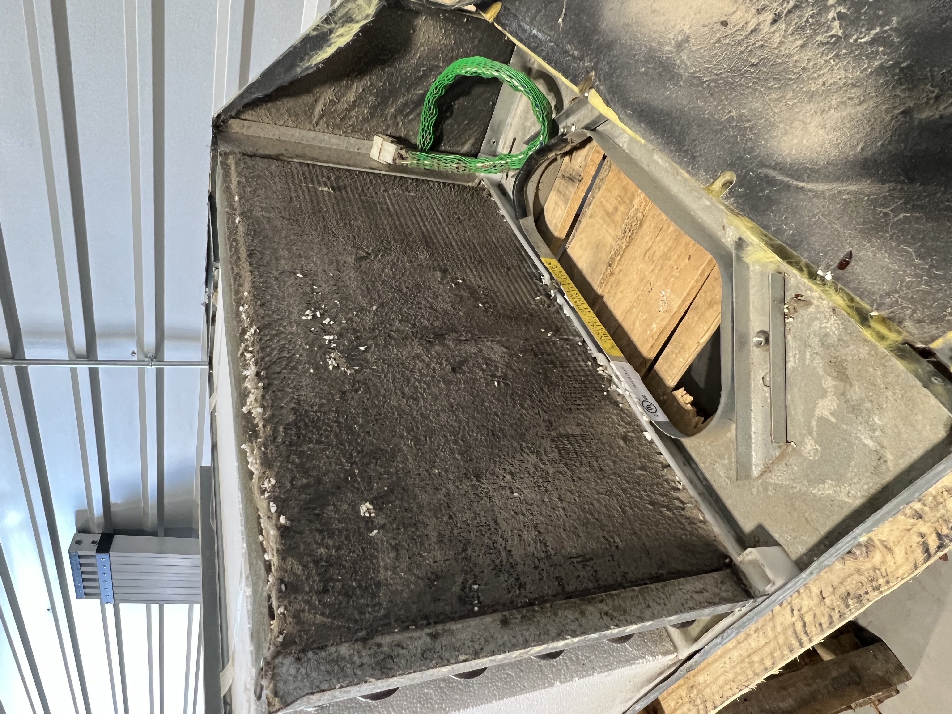 RV air conditioner evaporator coil with heavy debris buildup documented during a full RV maintenance visit — coil cleaning is a standard maintenance line item — Boss Bull Mobile RV Services