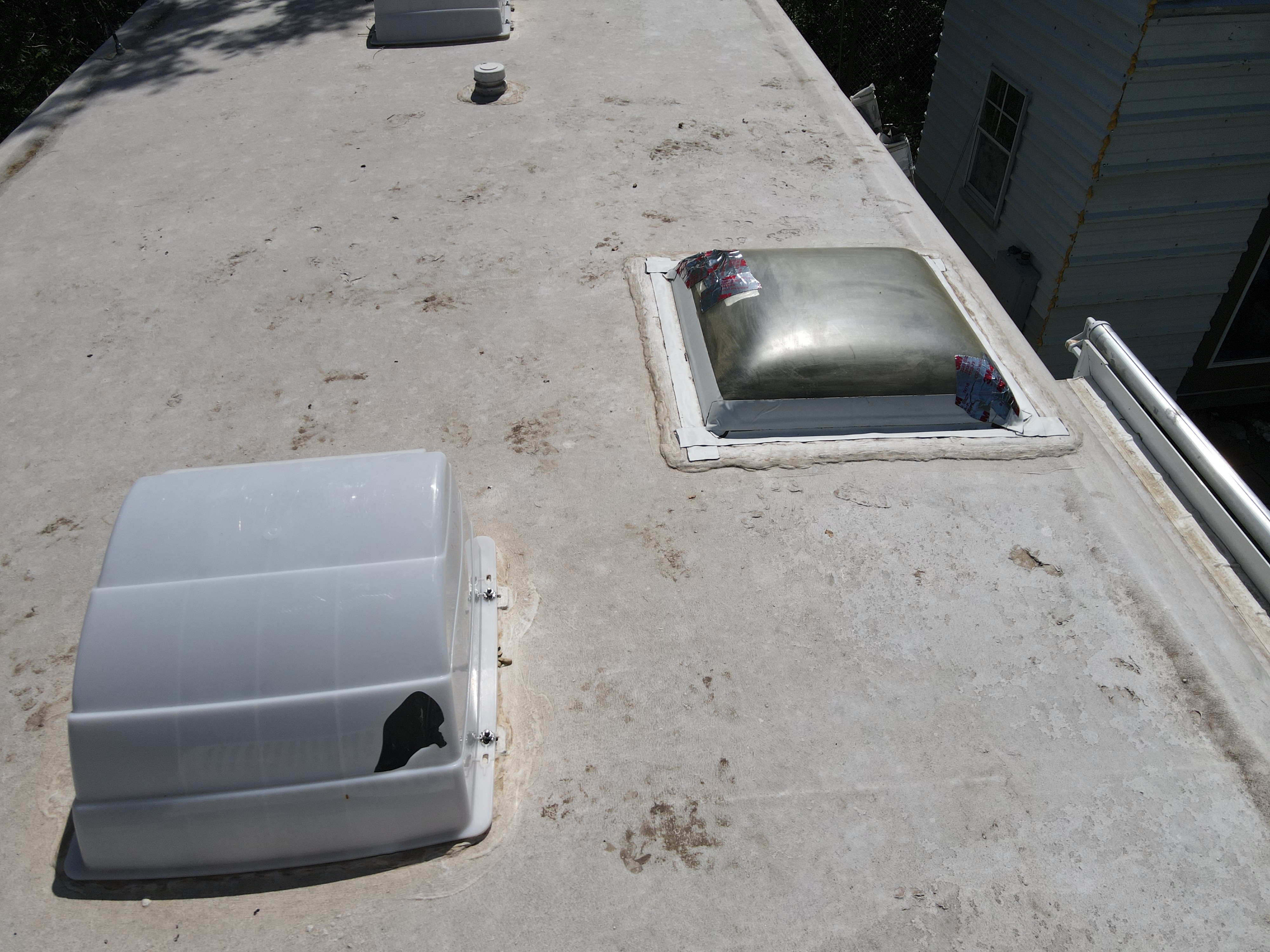 RV roof membrane with aging surface and failed penetration seals documented during a systems review — Boss Bull Mobile RV Services Central Texas
